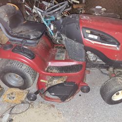 Two riding tractors
