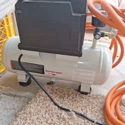 Two gallon air compressor and twenty five foot hose