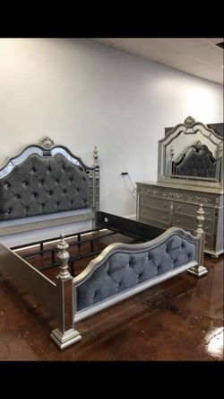 Bedroom includes dresser mirror queen bed