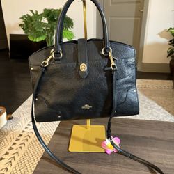 This is a Coach Mercer 30 Satchel in black grain leather with gold-tone hardware.  