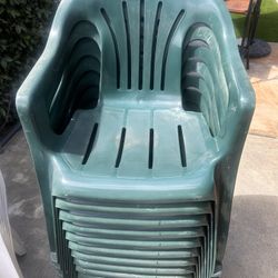 10 Green Plastic Stackable Chairs And 6 White Plastic White Chairs