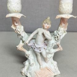 Porcelain candlestick holder with angel figure