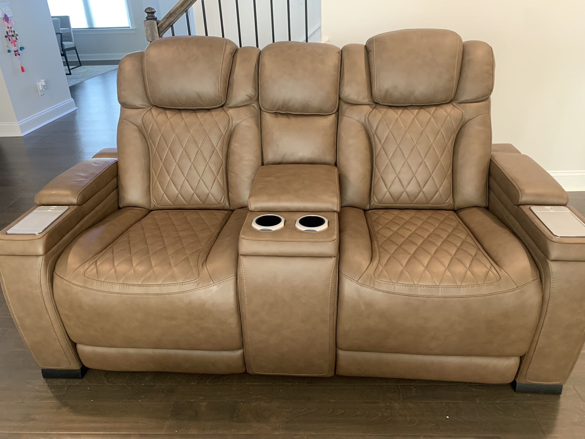 Power recliner with controls and wireless charging.