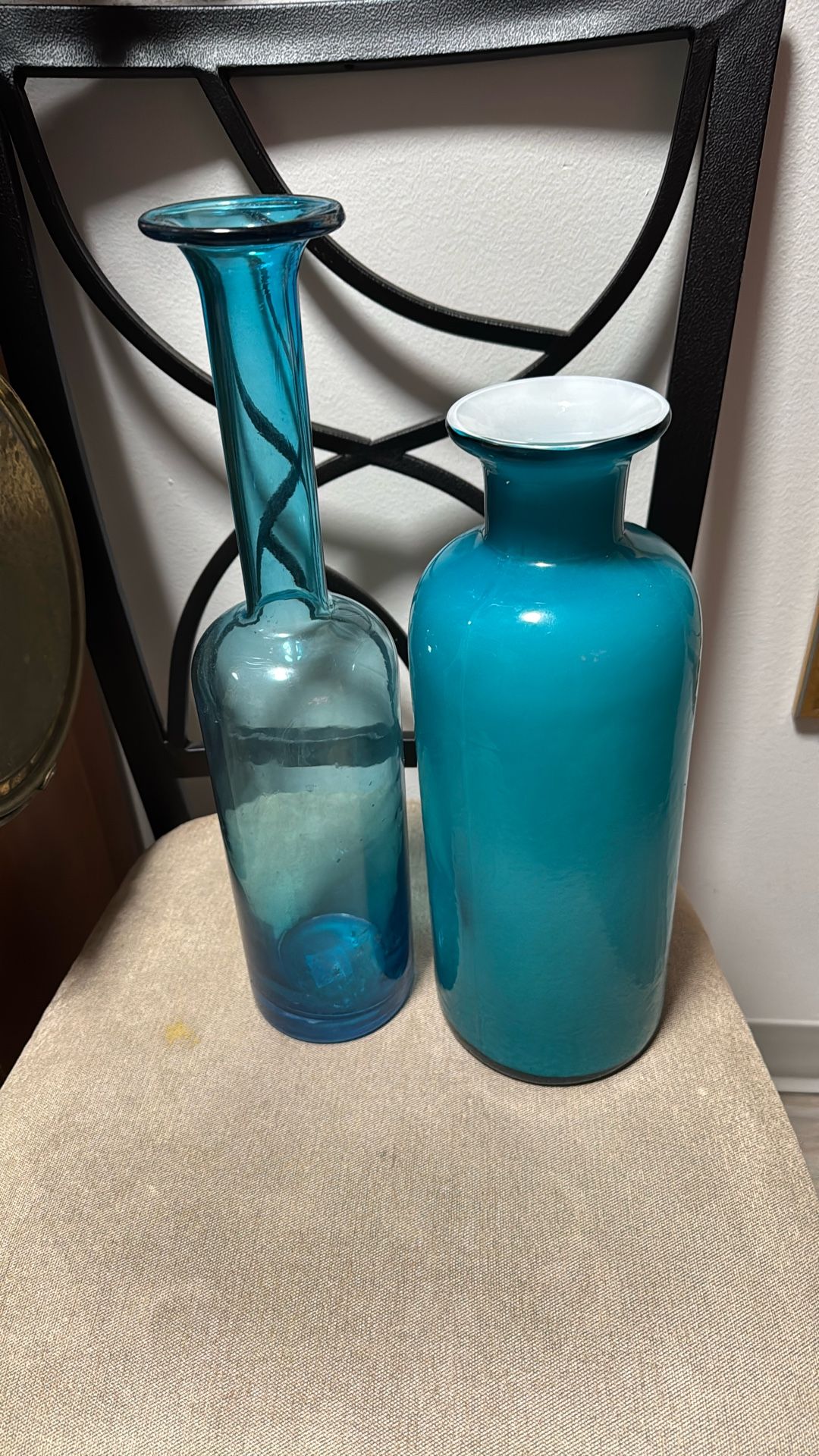One Is Light Blue Frosted Glass And The Other One Is Clear