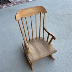 Vintage antique child rocking chair. Nichols and stone company