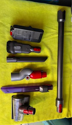 Dyson Outsize Cordless Vacuum battery and attachments