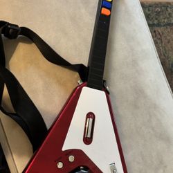 Guitar Hero–style guitar controller, specifically a Flying V–style 