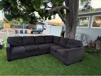 Two-piece dark gray L-shaped sofa
