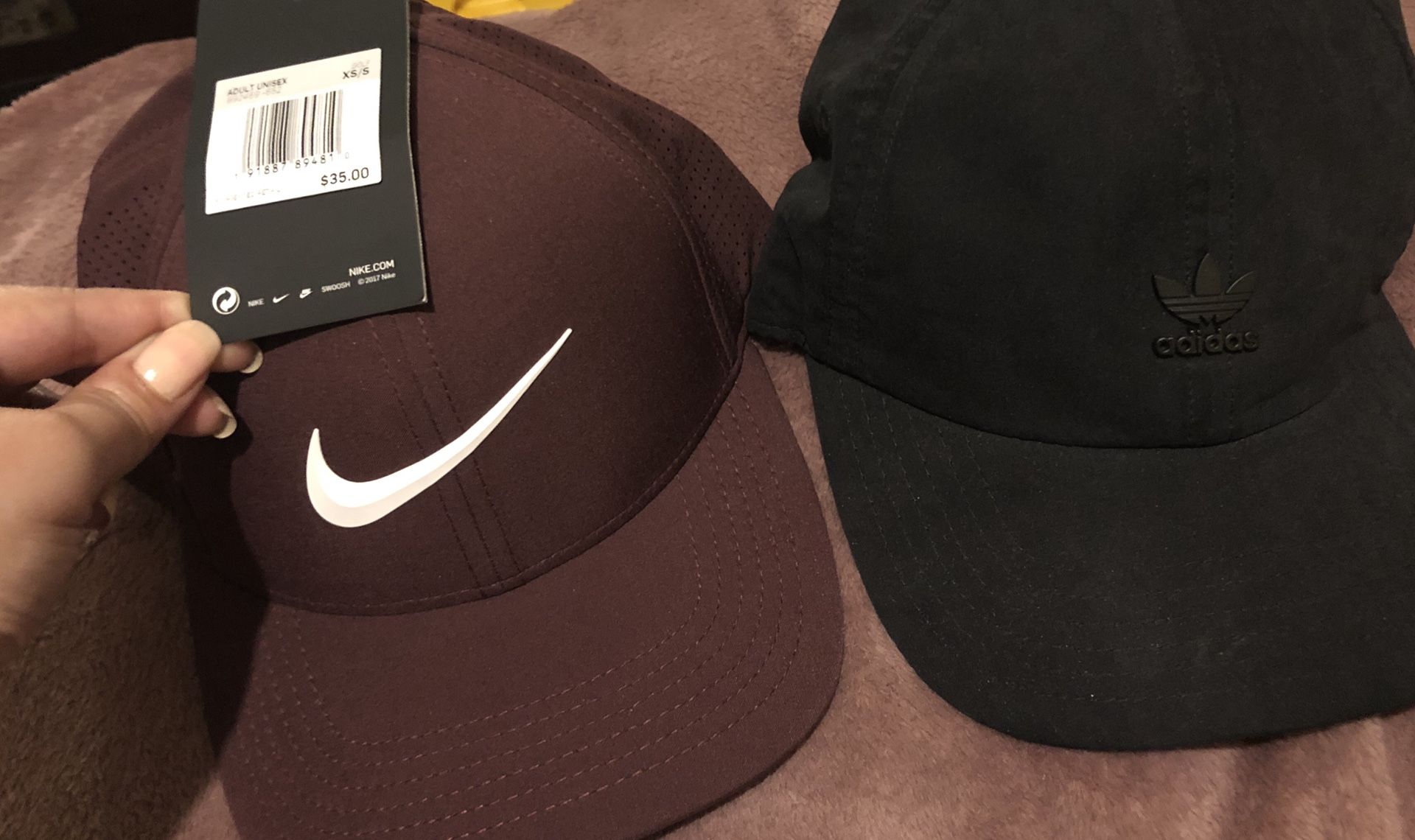 Maroon Nike and adidas hats