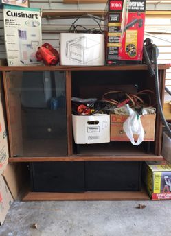 Solid oak entertainment center with glass storage doors