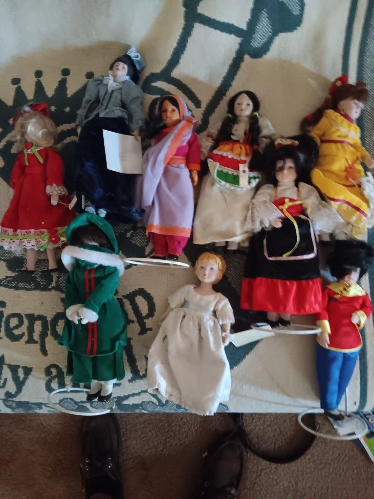 9 Ethnic Porcelain Dolls