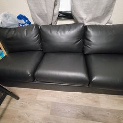 2 medium leather sofas 