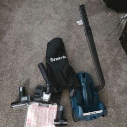Shark upright vacuum caddy and attachments.