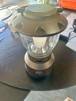 CAMPING LANTERN SUPER BRIGHT, USED ONE TIME IN BACKYARD. LIKE NEW.