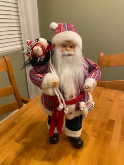 Santa doll holding lama wearing multi colored suit . Southwest flair. Rustic / Christmas. 18 inch.