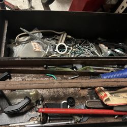 Vintage toolbox with a few tool and bunch of bolts hardware