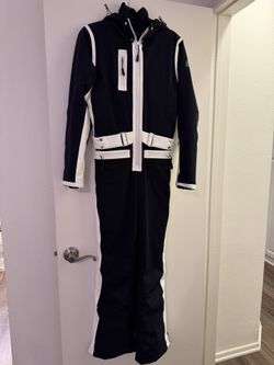 Nils Black and white one-piece ski suit. Excellent condition.