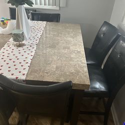 Marble table with eight chairs