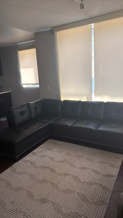 Black Leather Sectional Sofa with Nailhead Trim