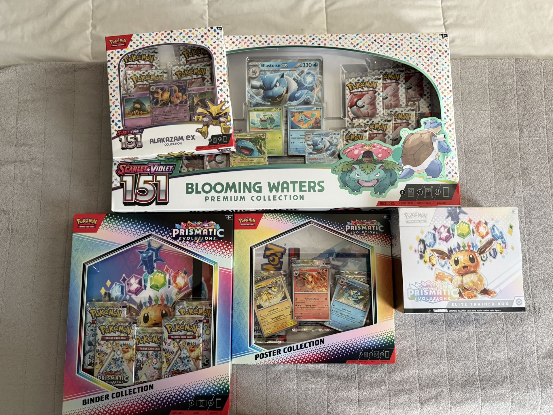 151 BLOOMING/ALAKAZAM BOX + PRISMATIC EVOLUTIONS BINDER/POSTER/ETB