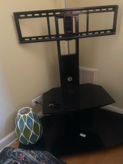 Black glass Tv stand (vase not included).