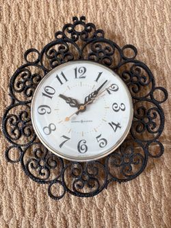 Vintage faux wrought iron clock