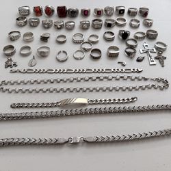 Silver rings, bracelets, chains and charms.