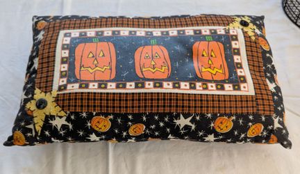 All for 25.00 Black cast iron-style 'Happy Halloween' tabletop sign on an orange wooden base, with two painted jack-o-lantern figures on each side.