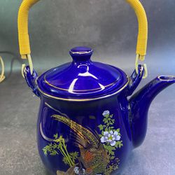 Vintage tea pots.  Vintage Cobalt Blue Peacock Teapot Japan Gold Flowers Braided Handle. $49.  Rare Teapot & Lid. Manufacturer unknown. Has chipped sp