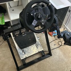 Logitech G920 (or G29/G923) racing wheel and pedals.