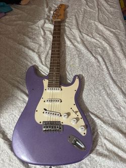 Purple sparkle electric guitar