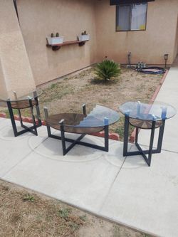 3 matching glass top tables