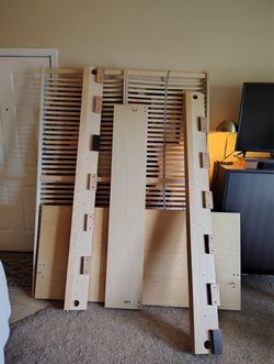 IKEA queen-sized bed frame with slats included