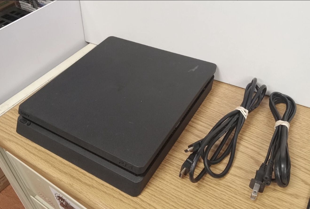 PS4, PS4 Charger, 2 PS4 Remotes And , 9 PS4 Games