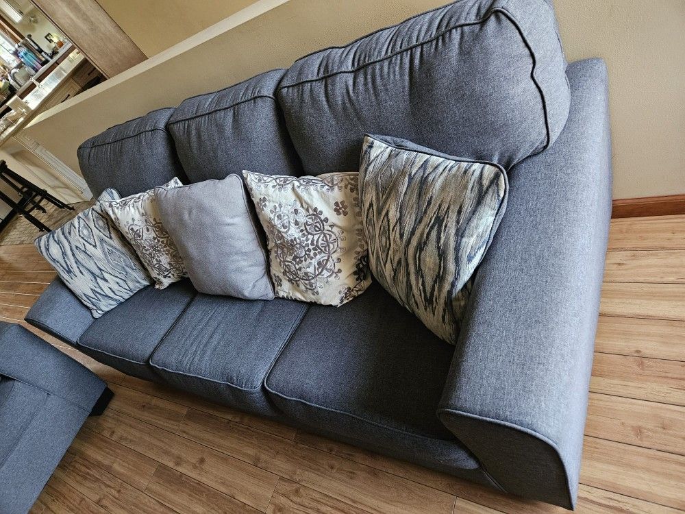Grey couches, excellent condition (less than 2 years old) 6 pillows.