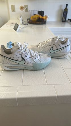 Nike white and Tiffany basketball shoes