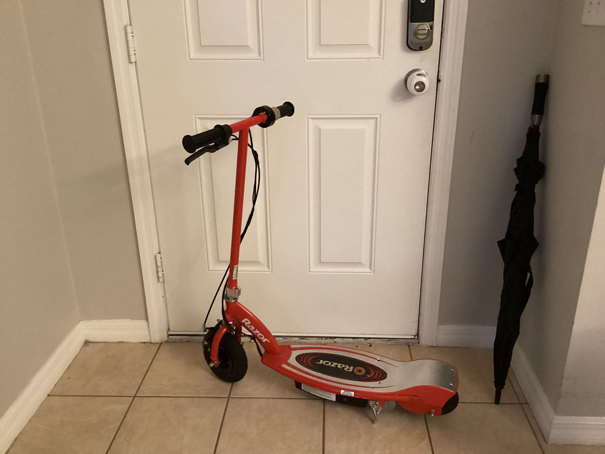 Razor E100 Electric Scooter for Kids Ages 8+ - 8" Pneumatic Front Tire, Hand-Operated Front Brake, Up to 10 Mph and 40 Min of Ride Time, for Riders Up