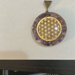 Amethyst pendant with symbol