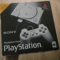 PS1 with controller. Games built in