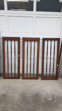 Antique wood and glass cabinet doors 1933