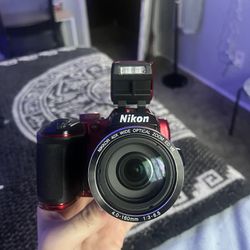 maroon Nikon CoolPix500 40x zoom