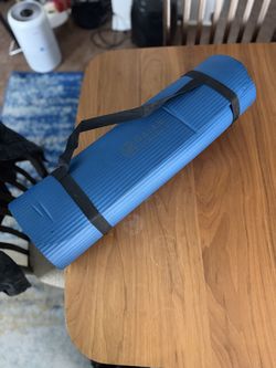 Two blue yoga mats with carrying straps