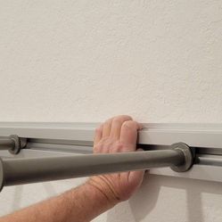 Wall rack with adjustable hanging bars