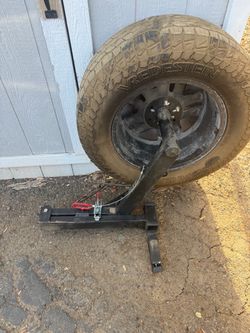 Rear hitch spare tire carrier