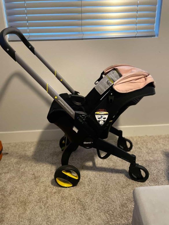 BABY GIRL DOONA STROLLER/CAR SEAT ALL IN ONE