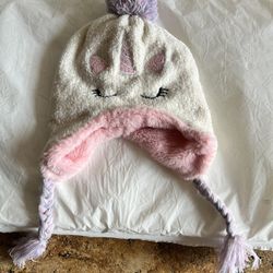 Adorable soft unicorn knit hat with pink lining and braided tassels. Features unicorn design with ears and horn.  New no tags  See Pictures Size M/L