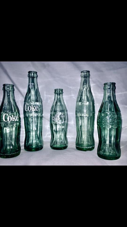 Vintage Collectible Coke Bottles .