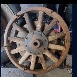 A set of 2  102 Year Old used 12  Wooden spoke dodge wheels 