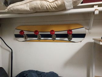 Skateboard hat rack