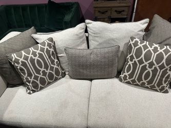 Light Gray Textured Sofa with Throw Pillows